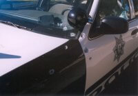 Patrol car with bullet holes